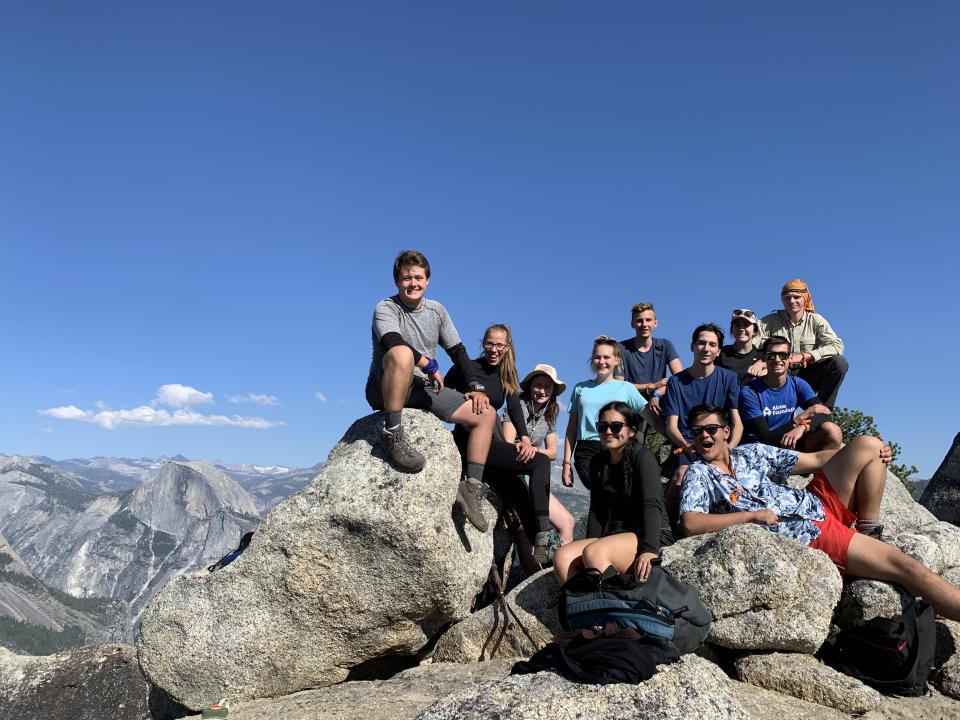 Group photo of Yosemite Alcoa Scholars with Half Dome in background