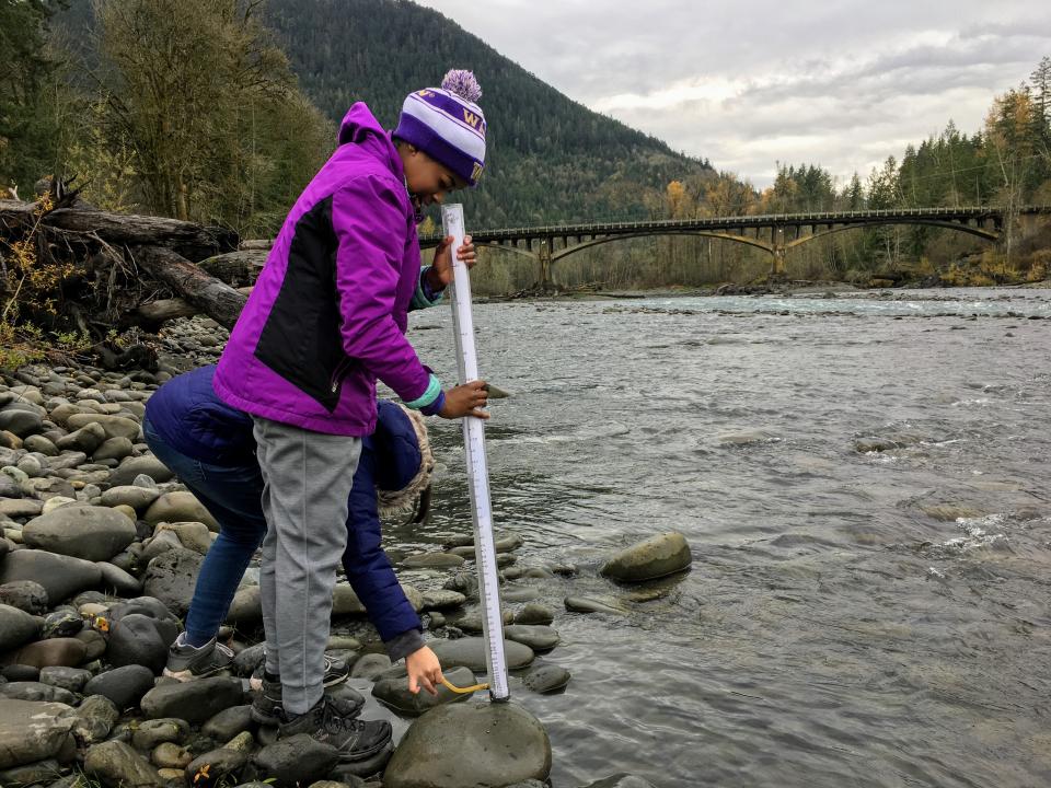 Students conducting science investigations at the Elwha River